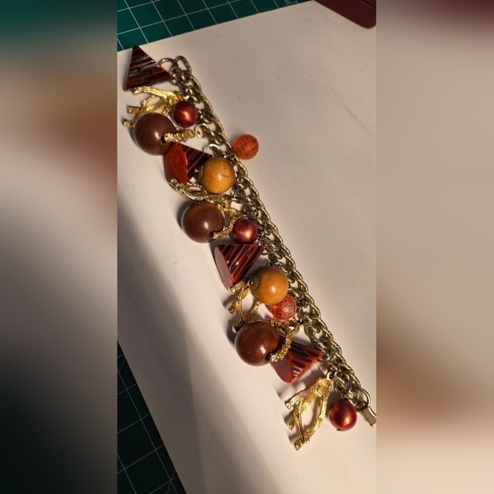Bakelite gold tone charm bracelet